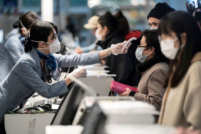 200219113446-coronavirus-temperature-check-0131-japan
